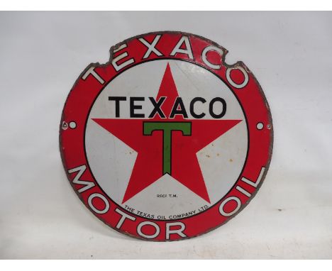 A Texaco Motor Oil circular double sided enamel sign with good gloss to one side, 26" diameter.