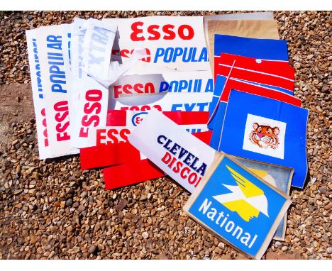 A quantity of plastic petrol pump brand inserts, petrol pump stickers, mainly Esso but also National and Cleveland.