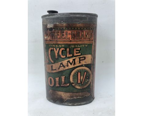 A rare and early Cycle Lamp Oil 'Wheel Brand' oval can with original paper label.