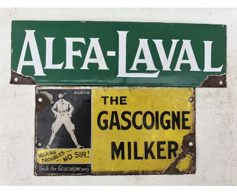 Two small enamel signs advertising milking machines. 