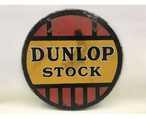 A Dunlop Stock circular double sided enamel sign, 18" diameter. 