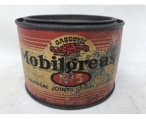 A Gargoyle Mobil Grease no. 5 circular tin.