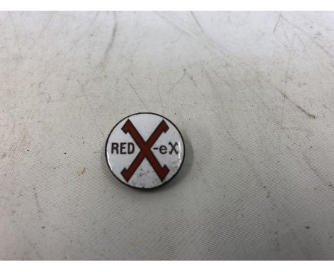 A Redex red and white enamel lapel badge.
