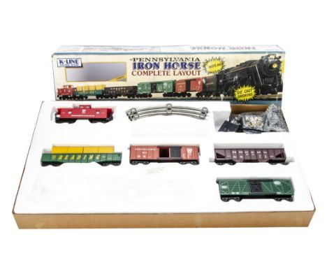 An incomplete K-line (American) 0 Gauge electric 'Iron Horse' layout set, lacking loco and tender, but including caboose, box