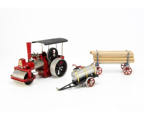 A Wilesco Live Steam 'Old Smoky' Steam Roller with Lumber Wagon and Water Cart, the roller in red/black (one of an uncommon s