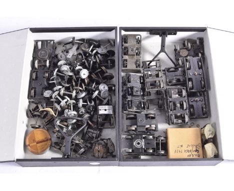 A Melée of coarse-scale 0 Gauge Coach Bogies, including 3 cast-metal 6-wheel bogies, 5 pressed tin dittos by LMC, others by B