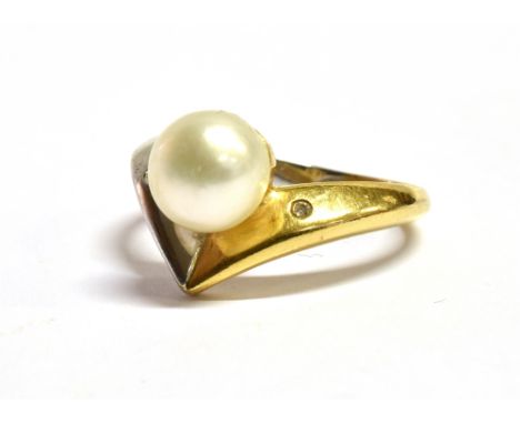 A MARKED 18KT 750 DIAMOND SET SOLITARE Pearl wishbone ring the cultured pearl measuring 0.9cm in diameter ring size O-P, weig