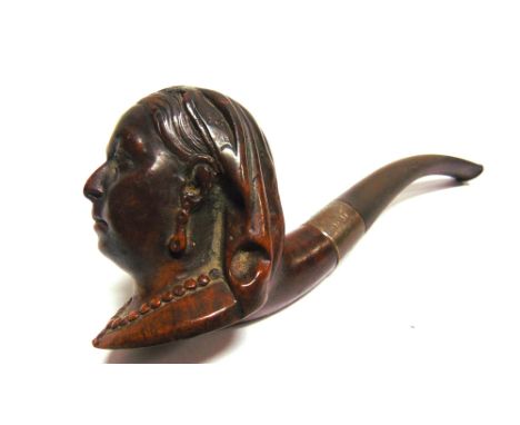 A ROYAL COMMEMORATIVE SOUVENIR PIPE  the briar bowl carved as a bust portrait of Queen Victoria, with a silver collar and a v