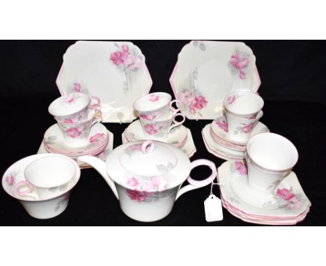 A COLLECTION OF SHELLEY 'REGENT' SHAPE TEAWARES  decorated in the 'Dog Roses' pattern, W12275, comprising: teapot, sugar bowl