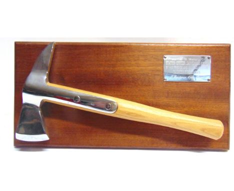 FIRE SERVICE MEMORABILIA - SOMERSET  comprising a presentation axe, mounted to a mahogany panel with an applied plaque engrav