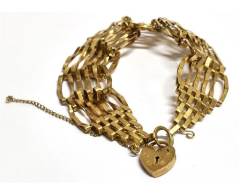 A 9CT GOLD HEART PADLOCK FOUR BAR GATE BRACELET 16.5 cm long, 2cm wide, 9.7 grams Condition Report : Safety chain present but