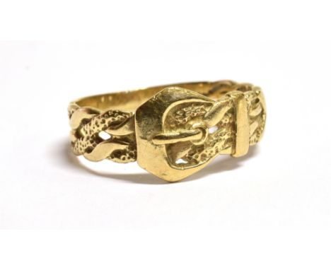 A 9CT GOLD BELT AND BUCKLE RING The ring with fancy open work shoulders and faded 375 hallmark to the shank, ring size T ½, w