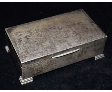 A SILVER BOX ON FOUR SQUARE FEET with engine turned design to the lid and plain sides, inlaid with wood and hallmarked for Bi