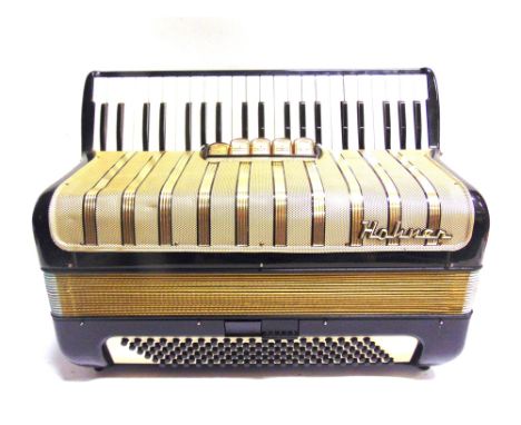 A HOHNER PIANO ACCORDIAN  with an applied retailer's plaque for Bell Accordians Ltd, Surbiton, cased.