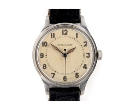 A VINTAGE JAEGER-LeCOULTRE GENTLEMENS WATCH Fitted with a stainless steel back, champagne signed dial, black Arabic numerals 
