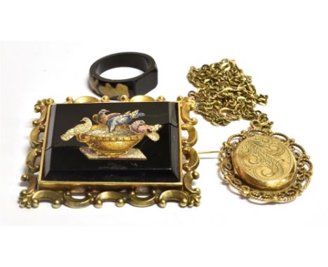 A 9ct GOLD LOCKET AND TWO PIECES OF COSTUME JEWELLERY The locket with an engraved scroll front with an ornate open work mount