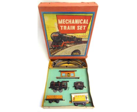 [O GAUGE]. A BRIMTOY NO.3 TRAIN SET  comprising a B.R. 0-4-0 tender locomotive, 67000, lined black livery, with a clockwork m