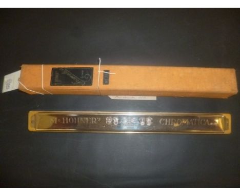 *M. Hohner's Chromatica Harmonica No. 261, made in Germany, introduced in 1910,  housed in its original cloth-covered box  (1