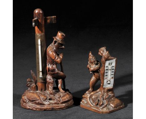*Black Forest. An early 20th-century Black Forest desk thermometer,  carved as a vagabond fox leaning against a sign post wit