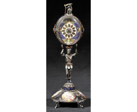 *Timepiece. A Continental enamel timepiece circa 1880,  the oval timepiece with black roman numerals, hinged glass door, surm