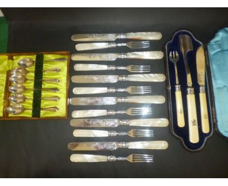 *Mixed silver. A Victorian set of twelve dessert knives and forks by John Gammage, Birmingham 1864,  each with mother of pear