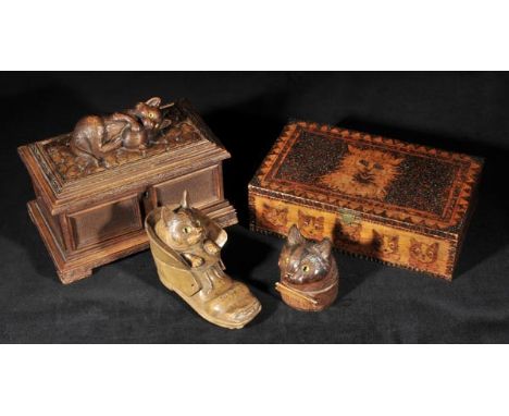 *Carved cats. A Swiss carved jewellery box,  the lid carved with a playful cat clutching a ball of wool, 15cm high x 21cm wid