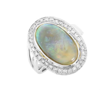 Approx. 4.22 Australian Black Opal, .44 Carat Diamond and 18 Karat White Gold Ring. Stamped 18K. Ring size 5-1/2. Approx. wei