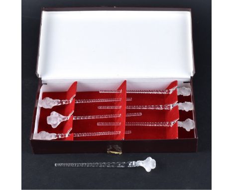 Seven (7) Lalique Crystal Swizzle Sticks. Six in box and one loose. Unsigned. Each stick measures 5" L. Condition: Good condi