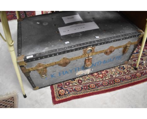 A vintage metal storage trunk
