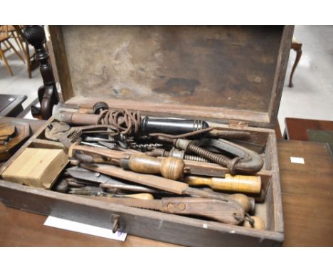 A vintage toolbox and contents