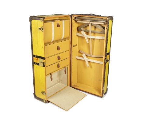 LOUIS VUITTON: A YELLOW VUITTONITE WARDROBE TRUNKc.1920Yellow Vuittonite canvas and wood bound, fully fitt interior with draw