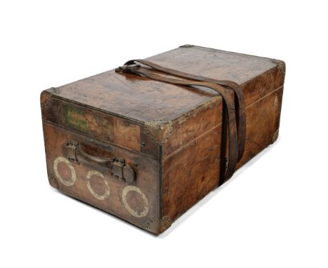LOUIS VUITTON: A LEATHER BOUND TRUNKc.1890Brown leather bound trunk with brass fittings, travel stickers to either side, four