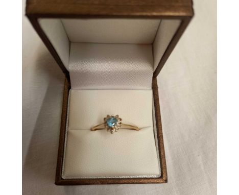 A 9ct RING WITH AQUAMARINE COLOUR HEART SHAPED CENTRE STONE (SOME BOARDER STONES MISSING)