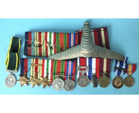 A WWII group of five medals: 1939-45, Africa (8th Army bar) and Italy Stars, War and Defence Medals, a Territorial Efficiency