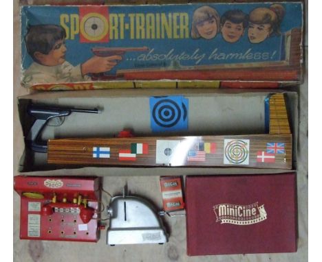 A Technofix tinplate "Sport Trainer" shooting gallery toy, boxed, a 'Codeg' telephone exchange toy and a boxed Minicine with 