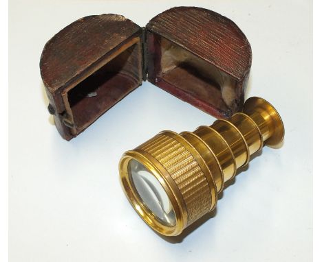 A 19th century Fraser brass six-draw pocket telescope engraved "Fraser, London", with convex end lens, in engine-turned outer