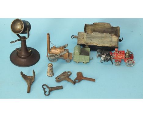 A Märklin tinplate search light, a Benbros Stephenson's Rocket and other items.
