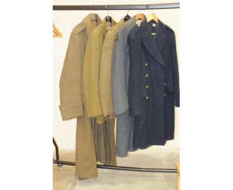 An army jacket labelled Flights Ltd, Camberley, one other, an army trench coat, an RAF great coat and a naval great coat, (al