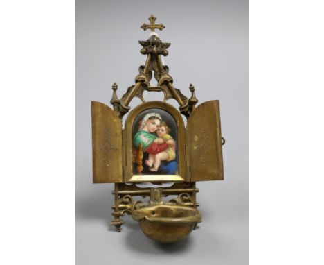 A Continental brass and ceramic religious plaque of a mother and child