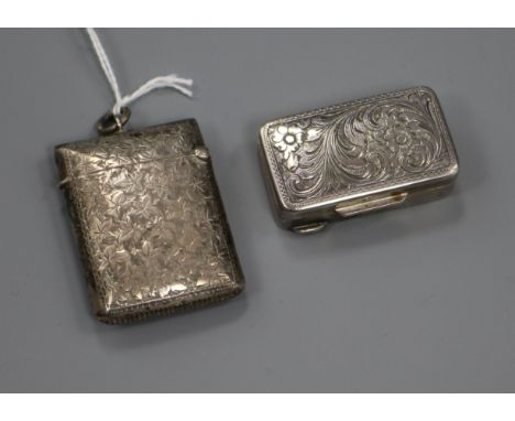 A Continental silver engraved patch box and a silver vesta case.