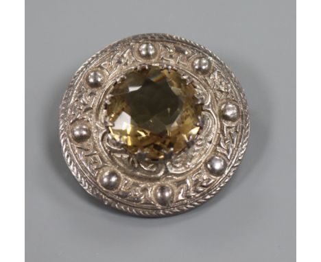 A Scottish celtic design silver and citrine cloak brooch, 38mm.