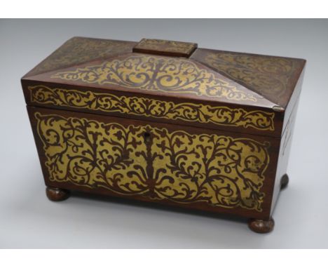 A Regency rosewood two-division tea caddy, of sarcophagus form inlaid with cut brasswork (two canisters, bowl deficient) leng