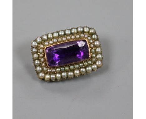 A Victorian yellow metal, amethyst and seed pearl brooch, 21mm.