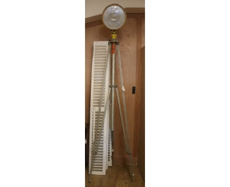 An indsutrail tripod lamp