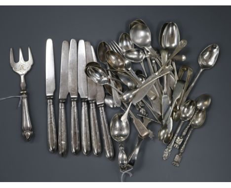 A silver spoon and pusher, a collection of small silver flatware, six silver-handled butter knives and a pickle fork, flatwar