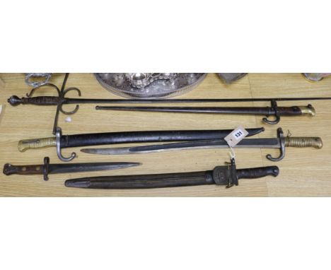 Three late 19th century French bayonets, a US Army bayonet, an EFD 1892 bayonet and an epee