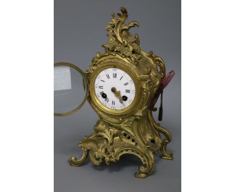 A 19th century gilt rococo style striking mantel clock height 29cm