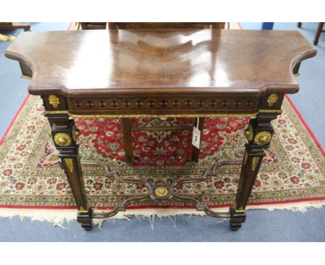 A Napoleon III walnut and bronze mounted console table W.112cm