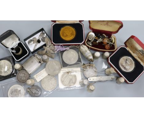 A sterling silver cigarette lighter, nine silver thimbles, a silver penknife, coins and sundries, the coins including two Pob