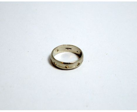 A DIAMOND BAND RING, with brilliant cut diamonds interspaced around the band, hallmarks are obscured, ring size M